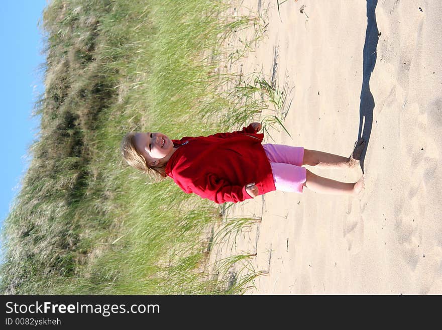 A smiling and happy child on the beach. A smiling and happy child on the beach