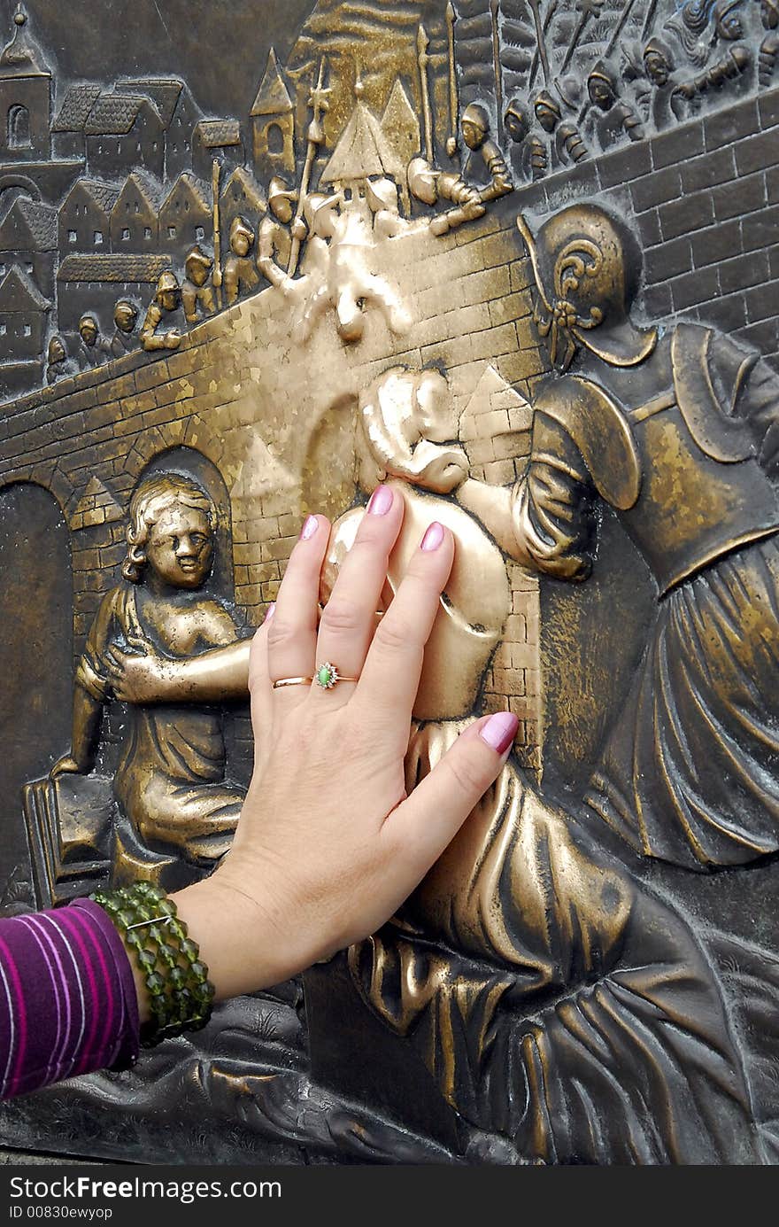 Touching the bronze plate on the statue of St John of Nepomuk is supposed to bring good fortune. Charles Bridge, Prague. Touching the bronze plate on the statue of St John of Nepomuk is supposed to bring good fortune. Charles Bridge, Prague.