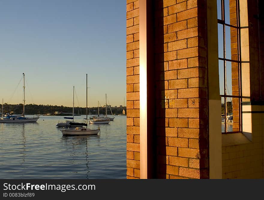 Warehouse wall and coastal  view with yachts. Warehouse wall and coastal  view with yachts