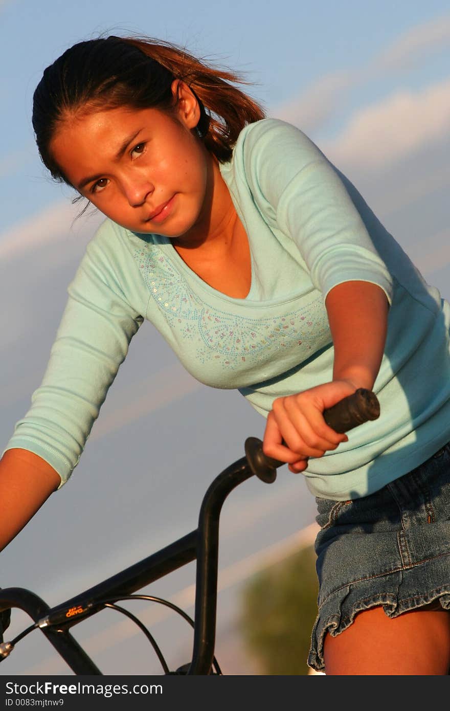 Half body shot of cute girl on bike. Half body shot of cute girl on bike