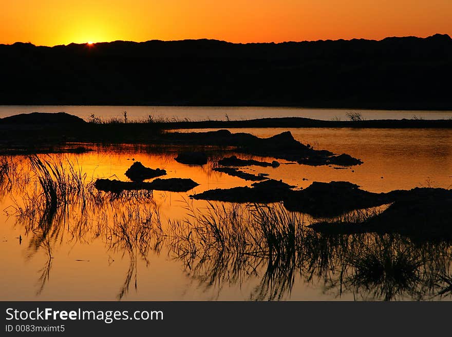 Sunset reflection in natural lake