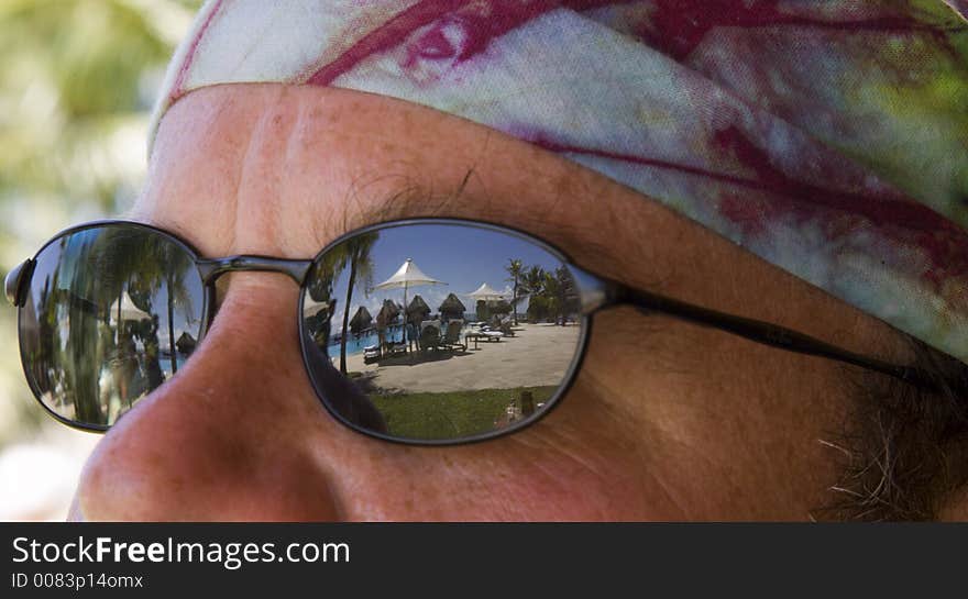 Reflection of beach umbrellas in sunglasses. Reflection of beach umbrellas in sunglasses