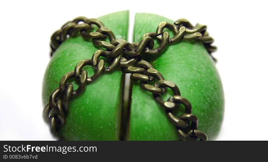 Apple cut and locked in chains. Apple cut and locked in chains.