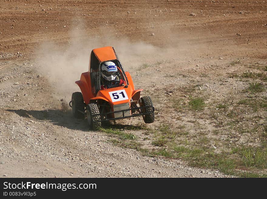 Six year old boy driving mini buggy. Six year old boy driving mini buggy.