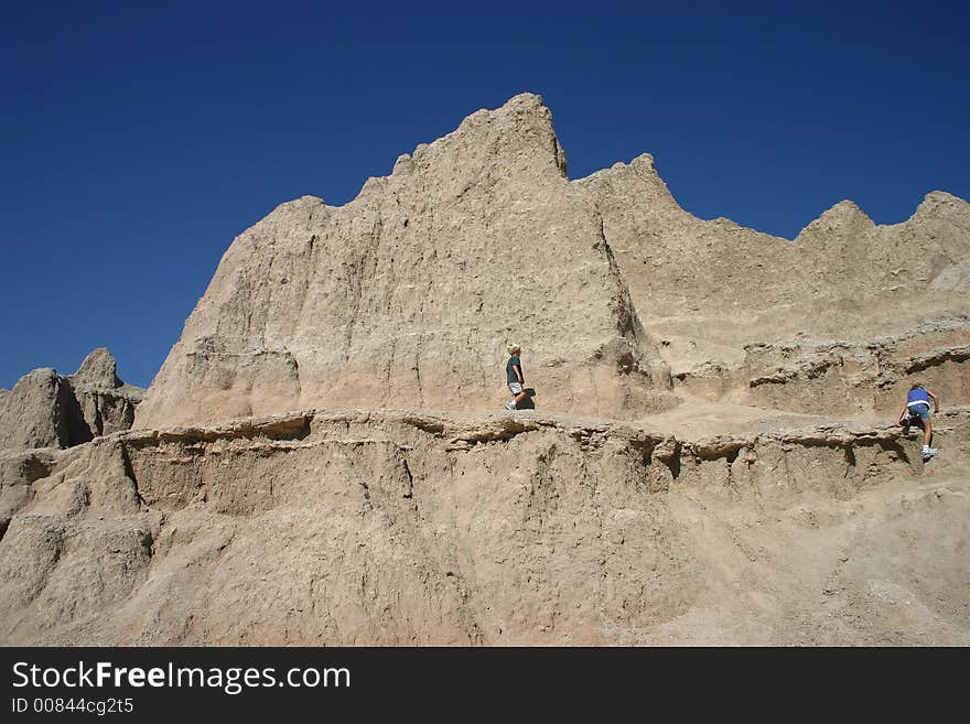 Two children hiking in the badlands