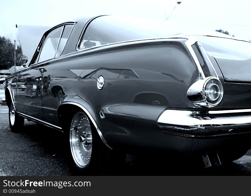 Black classic car view from tail lamp