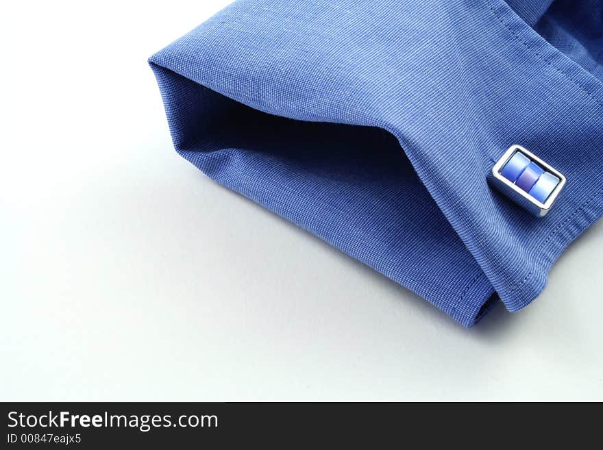 Cuff of a shirt on a white background. Cuff of a shirt on a white background.