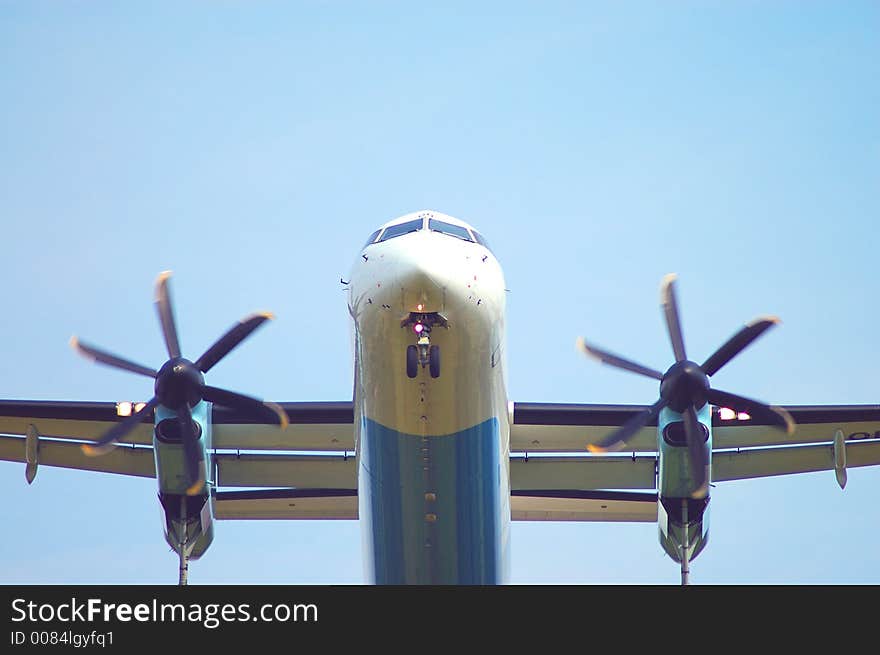 Landing plane, front on a blue sky. Landing plane, front on a blue sky