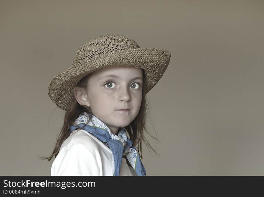 Little Girl Wearing Straw Hat