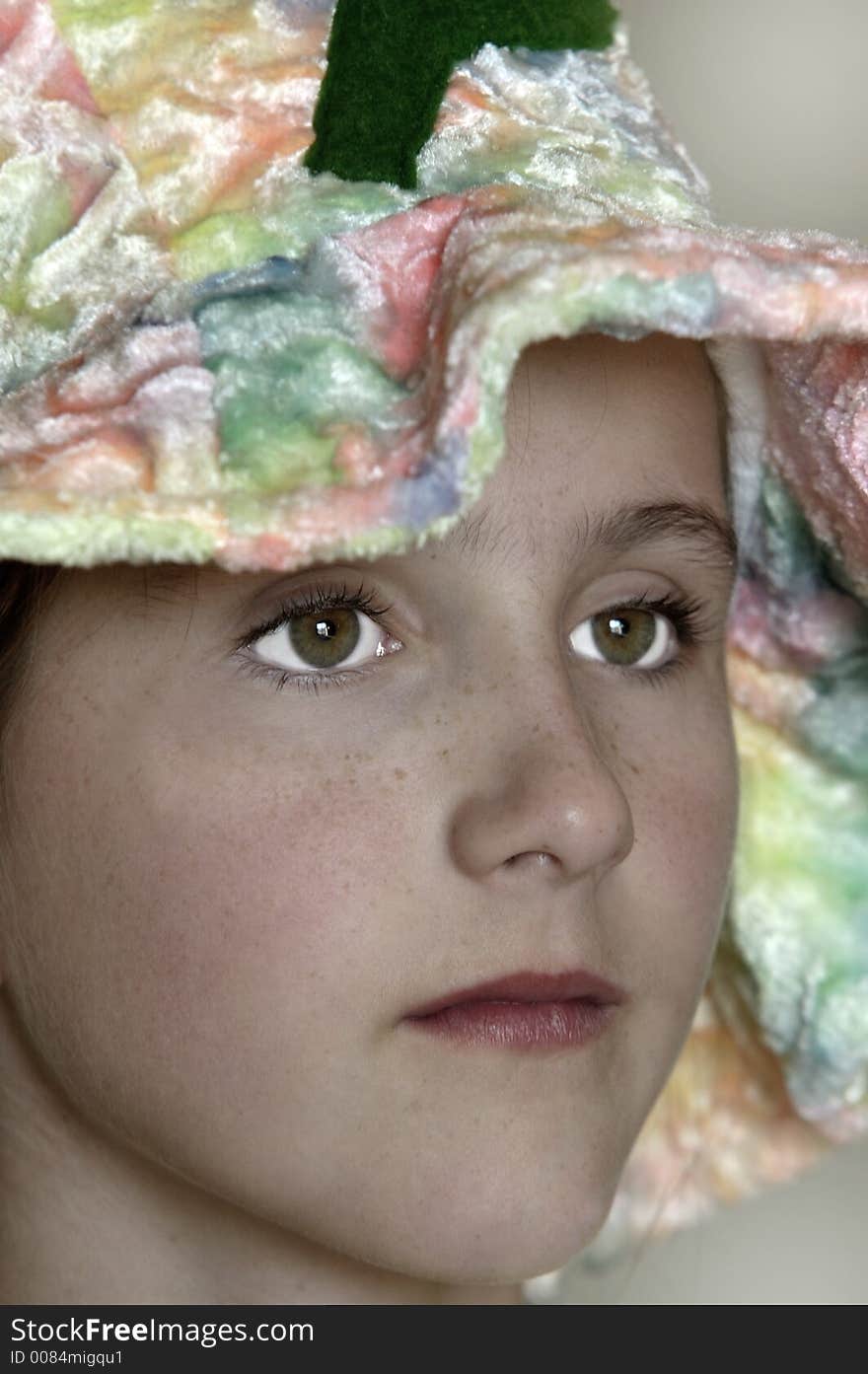 Young girl wearing colorful hat. Young girl wearing colorful hat