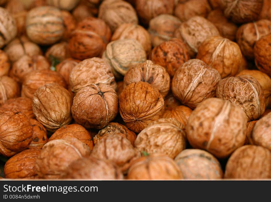 A lot of walnuts on the market display.