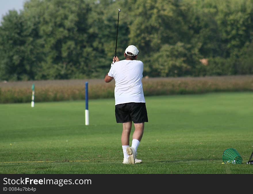 A Man Practicing His Swing