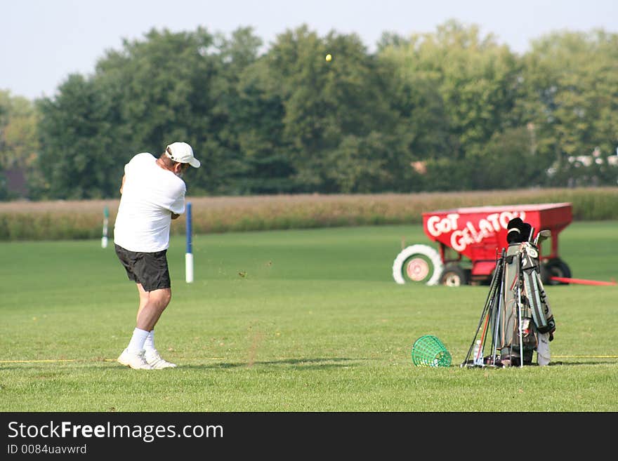 A man practicing his swing