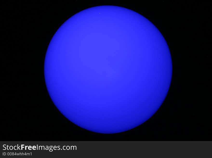 An abstract glowing blue moon