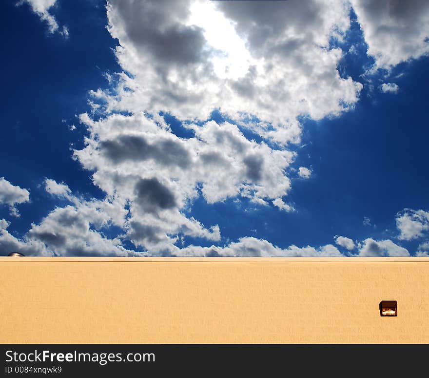 Afternoon Blue sky behind a wall. Afternoon Blue sky behind a wall