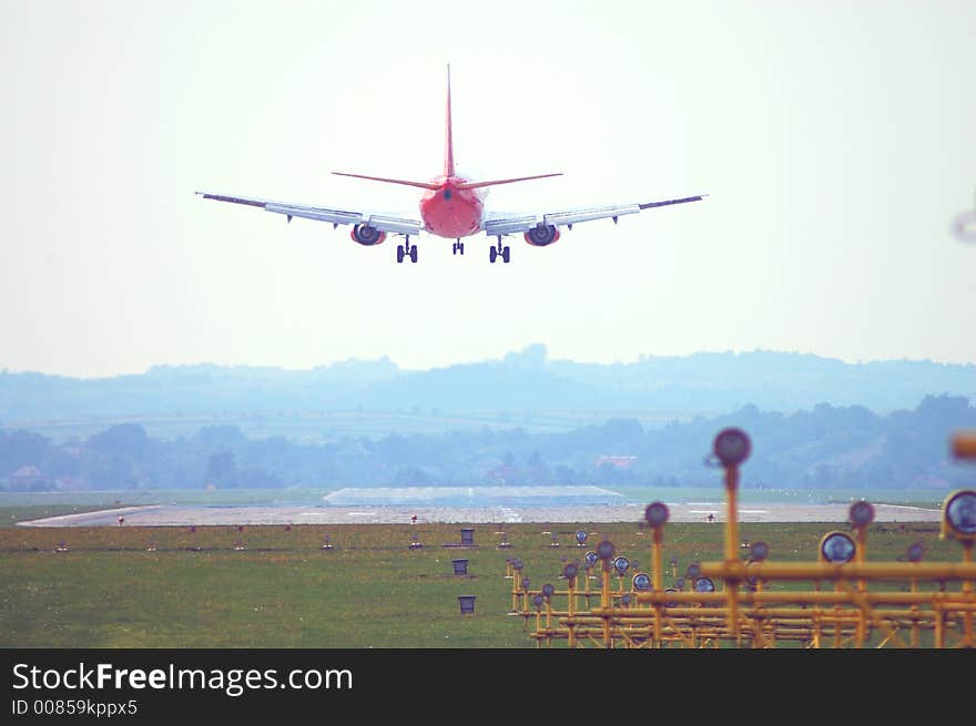 Plane red jet which land on airstrip red. Plane red jet which land on airstrip red