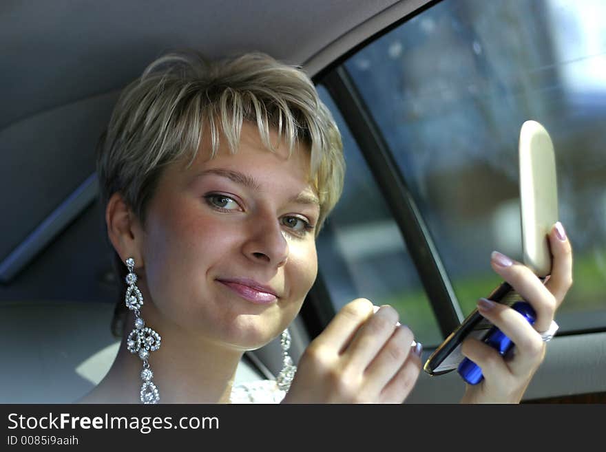 The beautiful bride corrects for a make-up