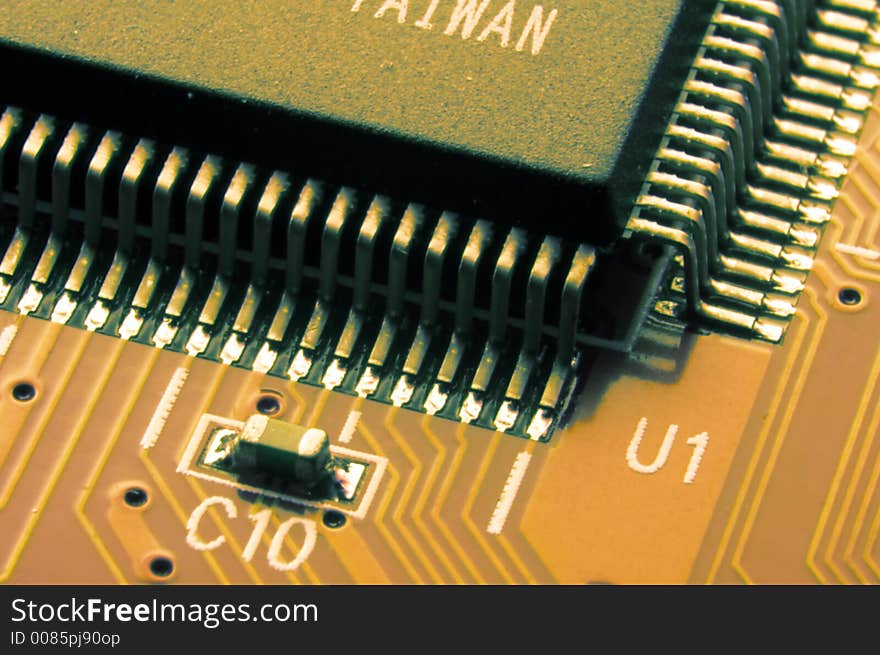 Big microcircuit on a orange board