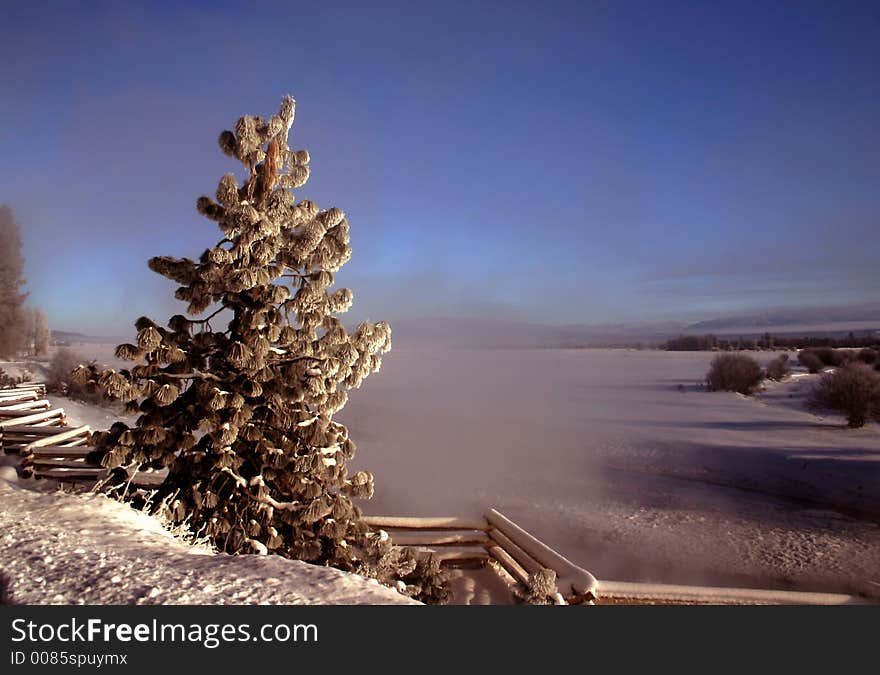 Steam rises from hot springs on 20 degrees below zero morning in wesr central Idaho