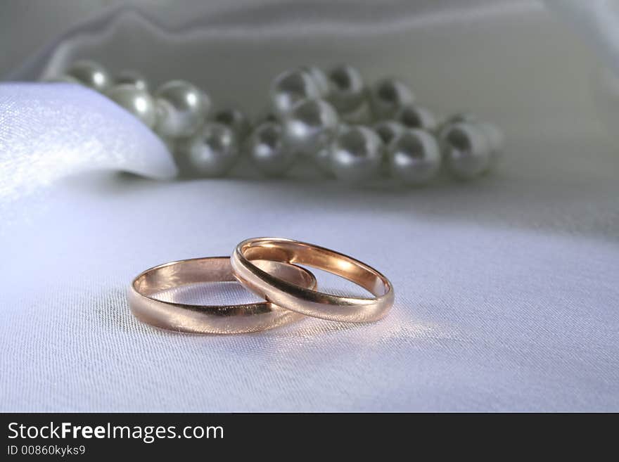 Wedding rings on a silk background