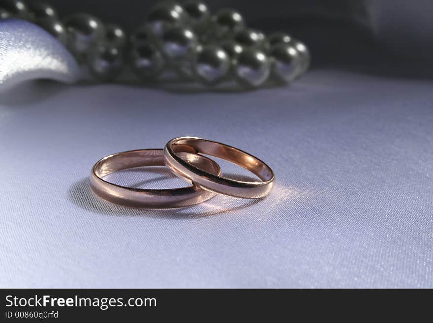 Wedding rings on a silk background