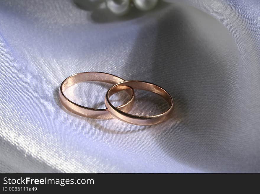 Wedding rings on a silk background