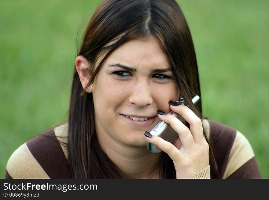 Girl laughing on cell phone. Girl laughing on cell phone