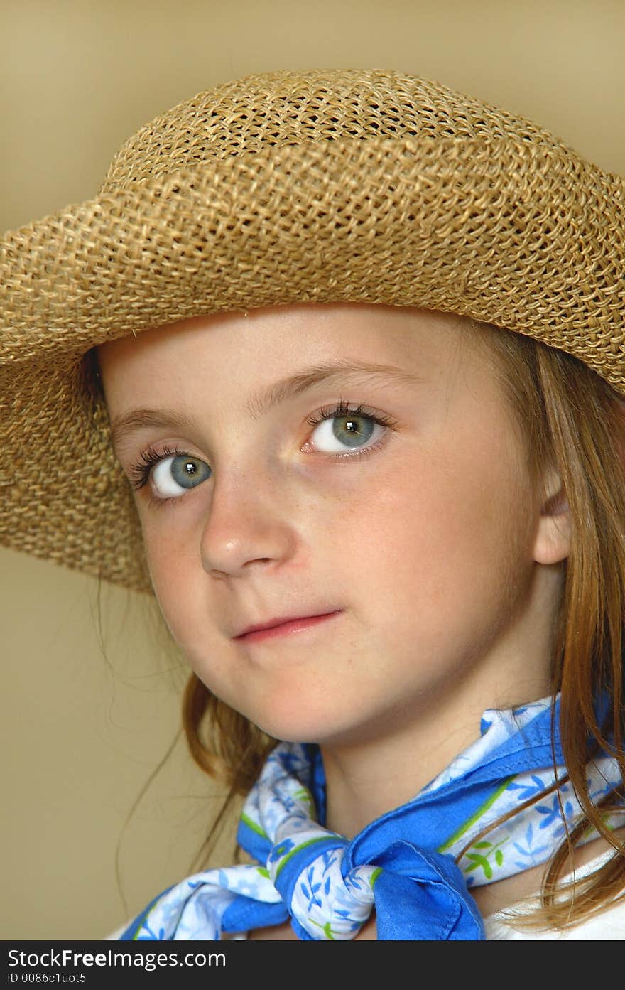 Little girl wearing straw hat with big eyes. Little girl wearing straw hat with big eyes