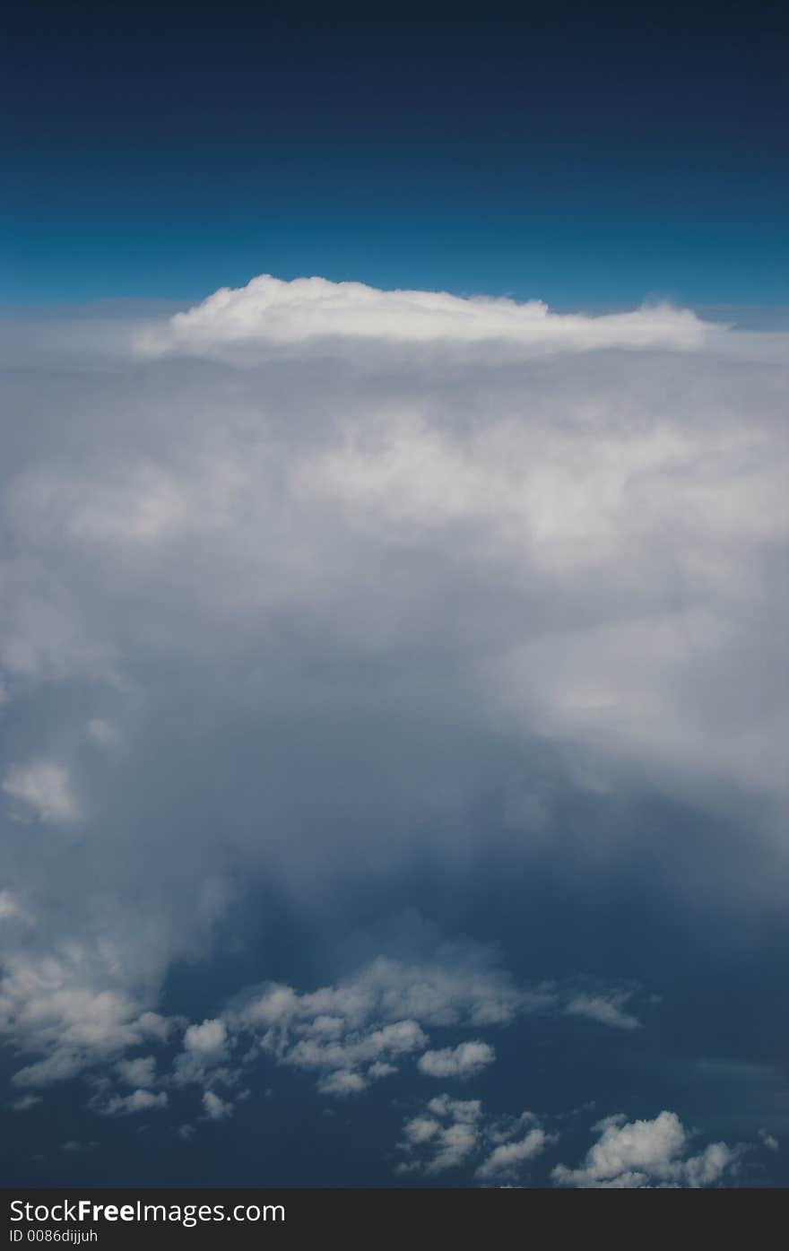 Weather above the European Alps seen from an airplane at 28.000 feet. Weather above the European Alps seen from an airplane at 28.000 feet.