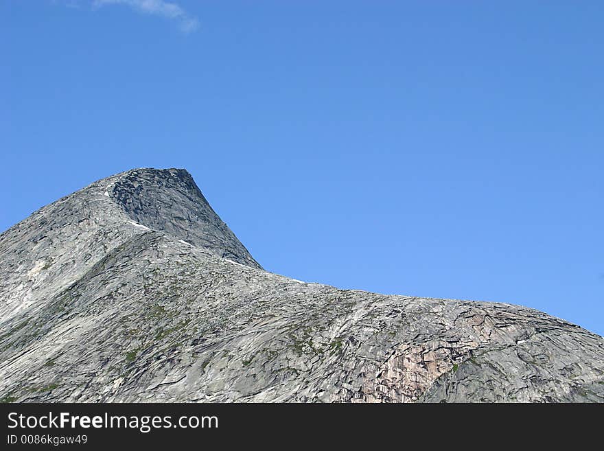 View on a mount peak along the E6 between Ulvsvåg and Tømmerneset in Nordland in the north of Norway. View on a mount peak along the E6 between Ulvsvåg and Tømmerneset in Nordland in the north of Norway.