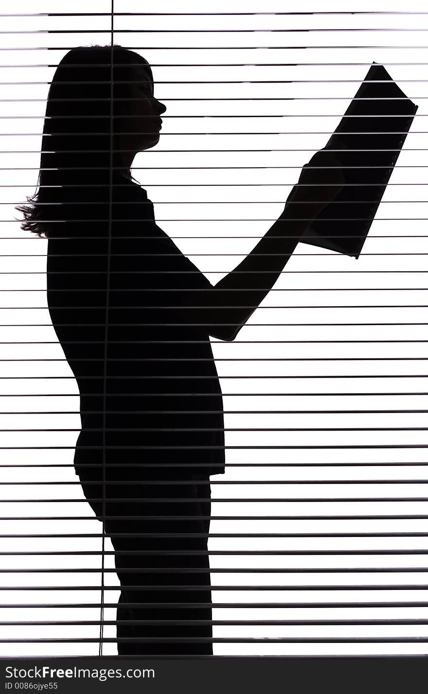 Silhouette of woman with papers