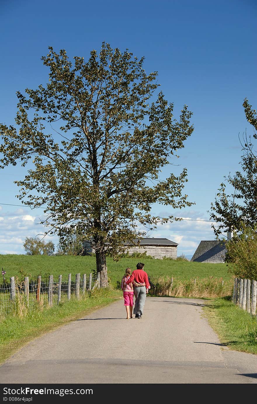 Lovers taking a walk with a tree