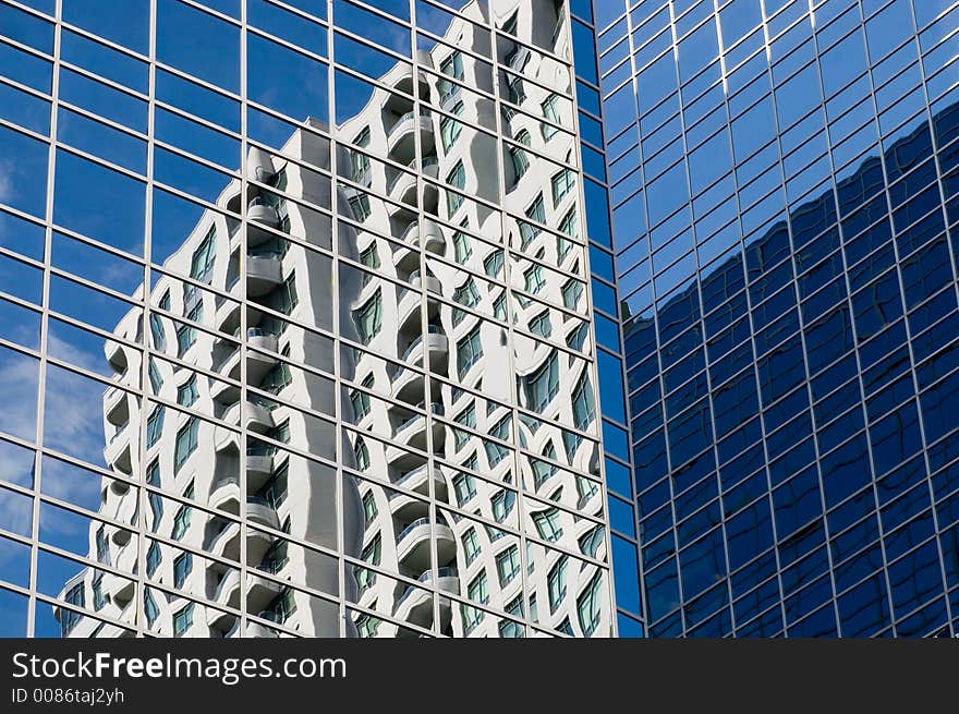 One building warped in the glass of another. One building warped in the glass of another.