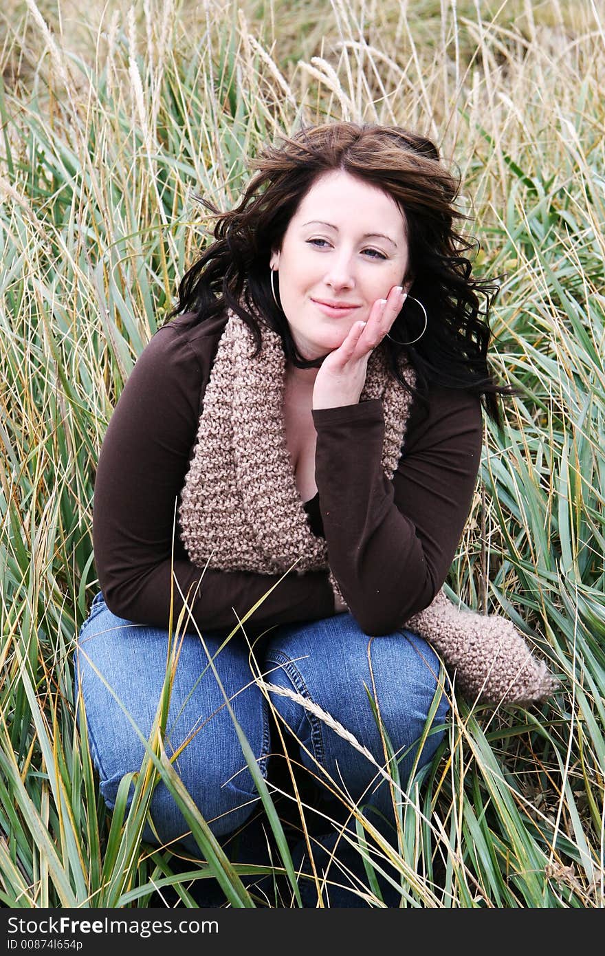 Young woman in grass, outdoors