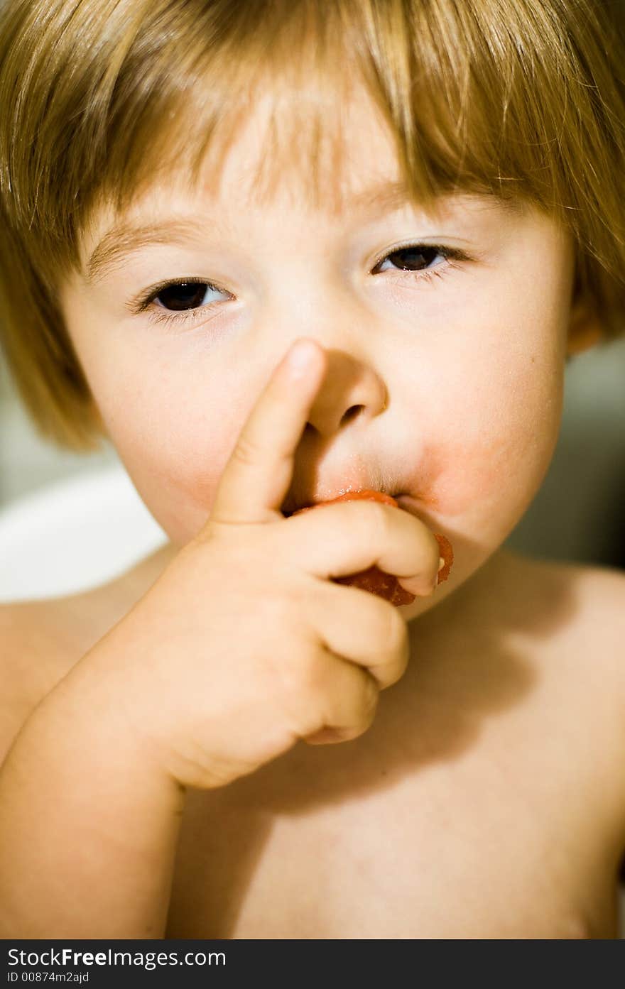 Young child eating a watermelon