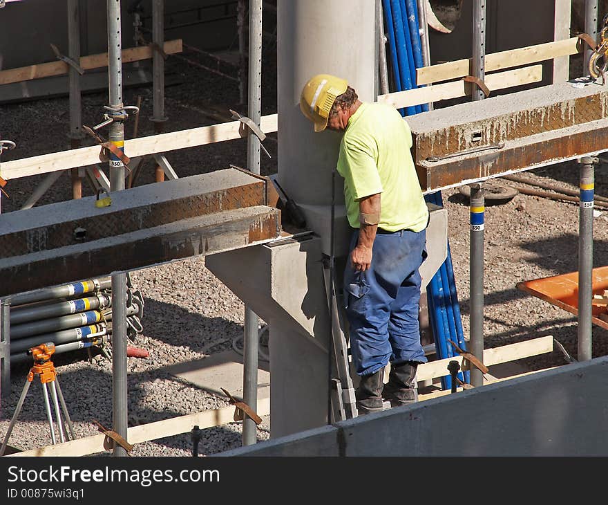 Worker checks floor reinforcement placement