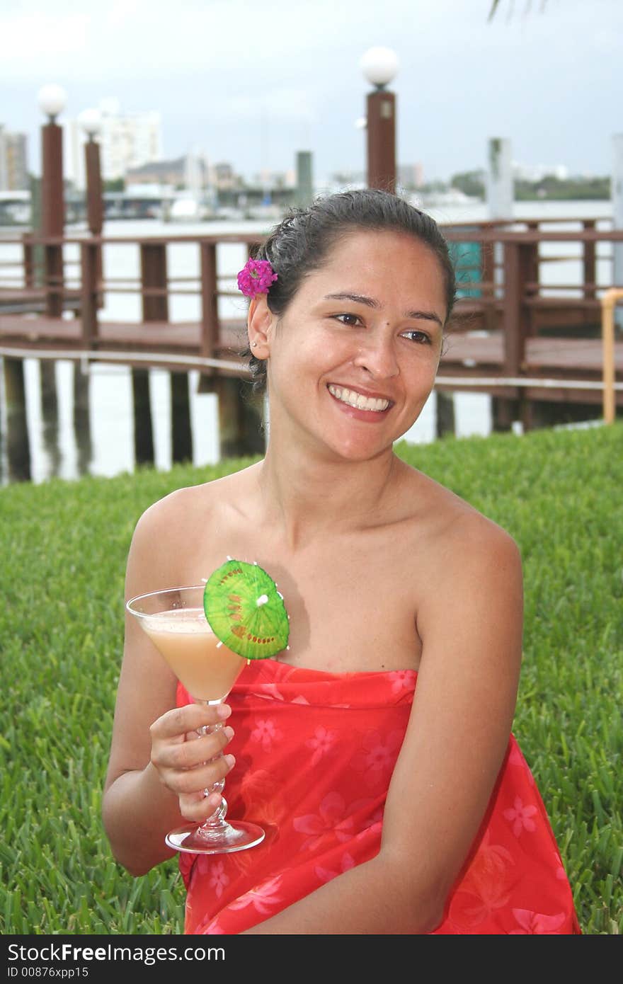 Girl smiling with a colada drink. Girl smiling with a colada drink