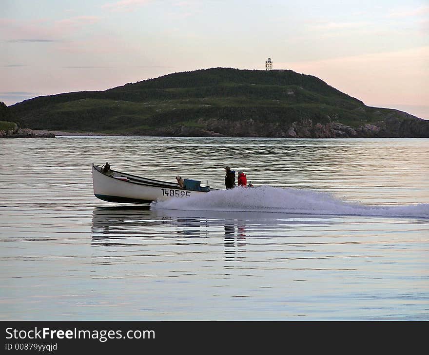 A boat cruises the ocean. A boat cruises the ocean