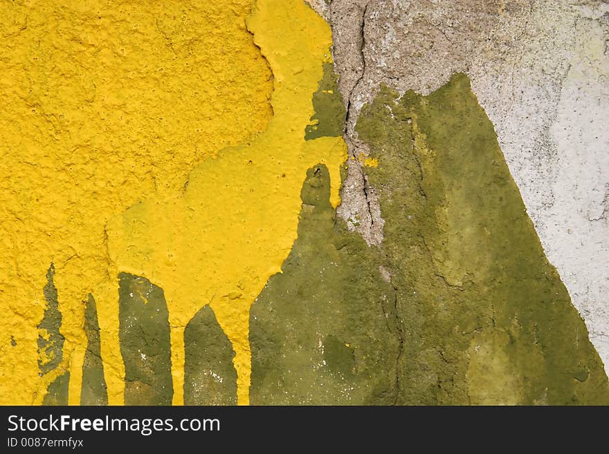 Concrete wall with yellow and green motif