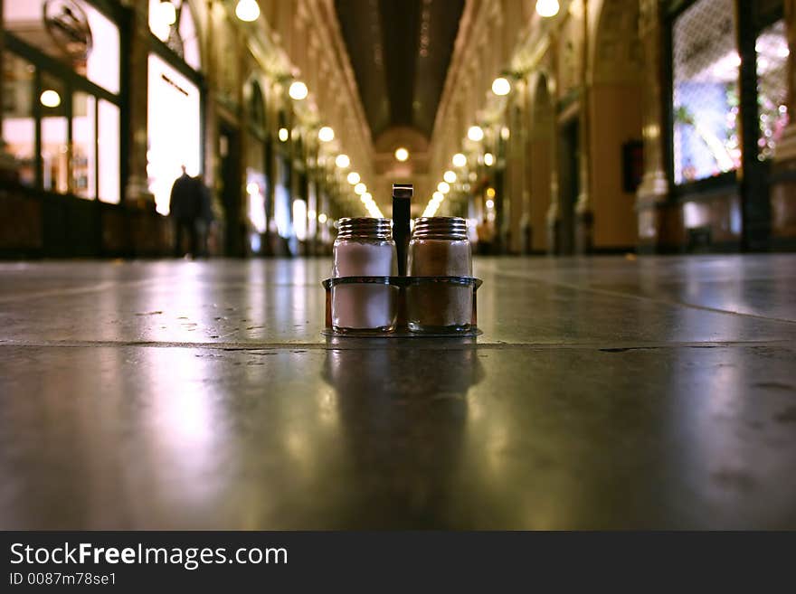 Salt&pepper on the ground of a shopping gallery (worm's-eye view). Salt&pepper on the ground of a shopping gallery (worm's-eye view).