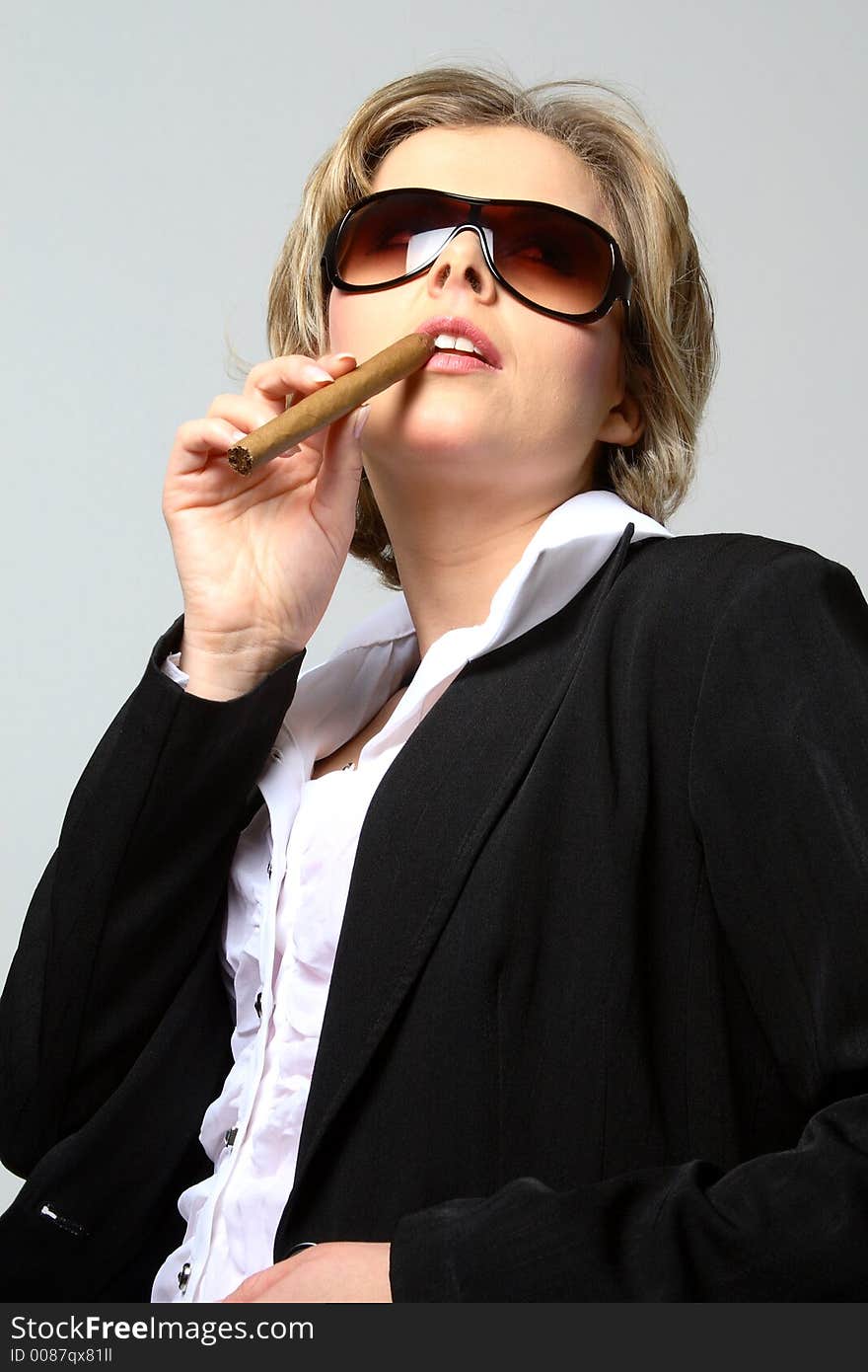 Blond Business Woman Smoking A Cigar