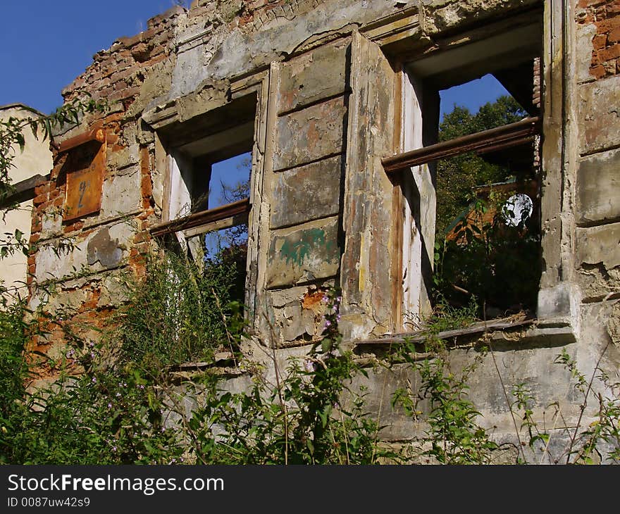 Utter desolation 2 (windows in disturbed building, address on a plate  changed). Utter desolation 2 (windows in disturbed building, address on a plate  changed)