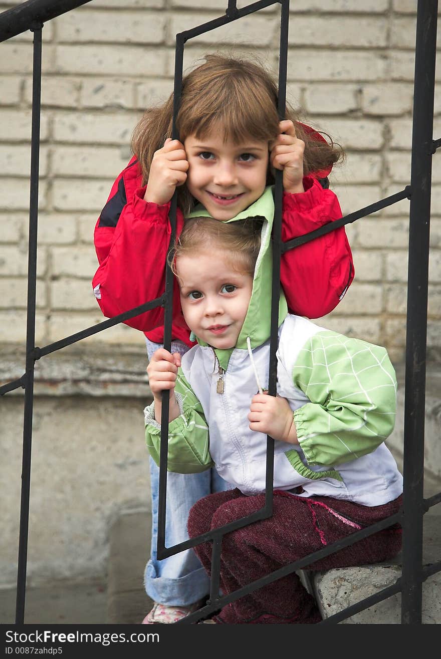 Two girls play on stairway. Two girls play on stairway