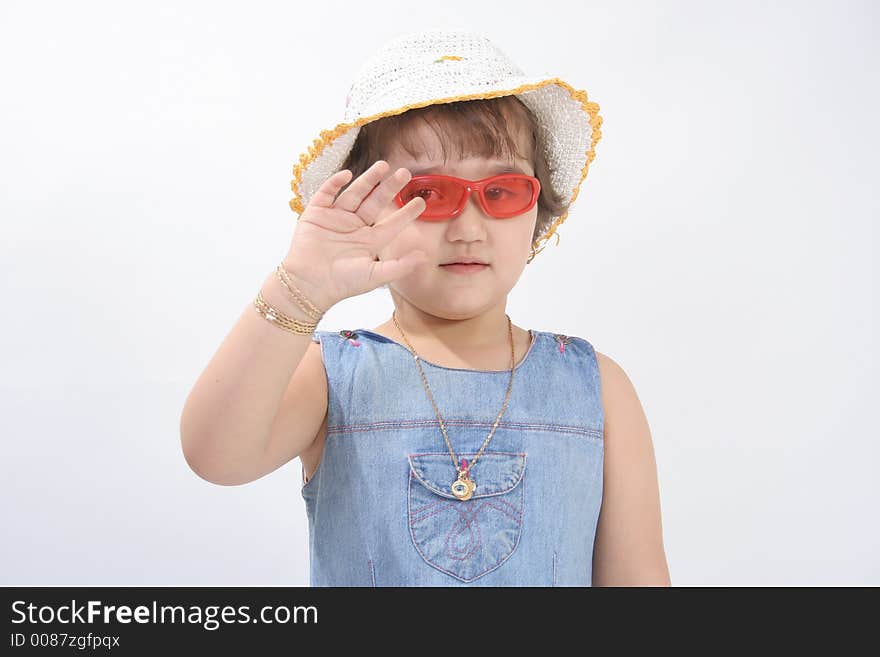 Portrait of a little girl with red sun glasses and hat. Portrait of a little girl with red sun glasses and hat