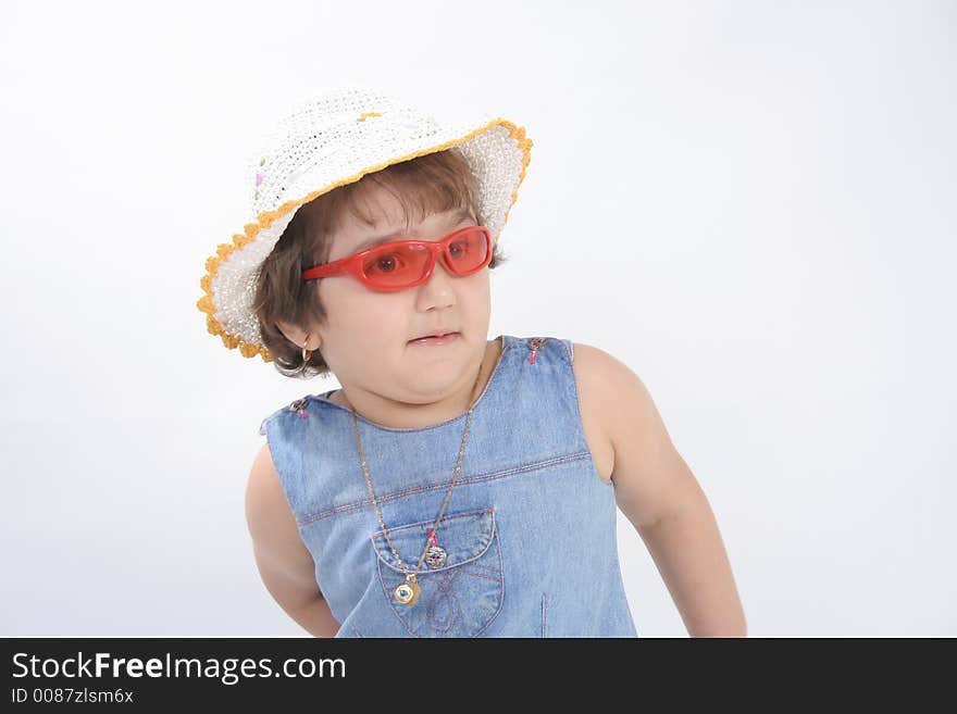 Portrait of a little girl with red sun glasses and hat. Portrait of a little girl with red sun glasses and hat