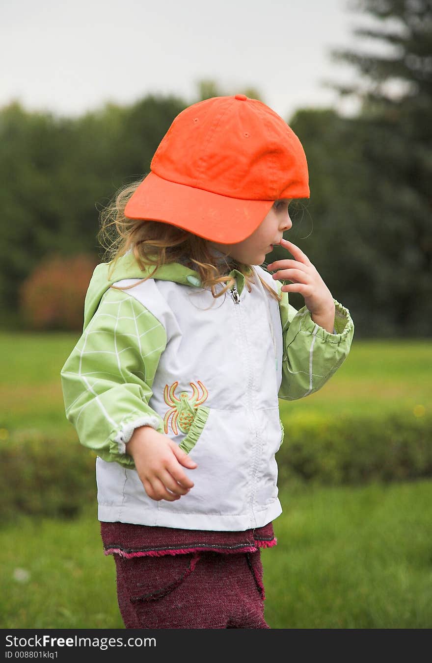 Little baby with cap in autumn. Little baby with cap in autumn