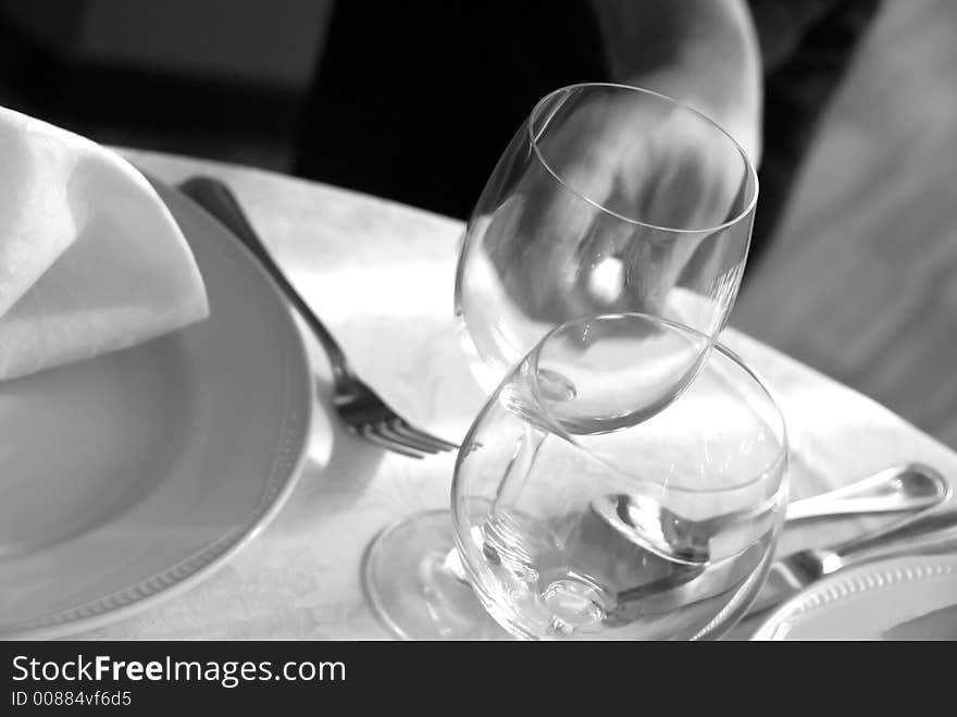 Glass, spoon and fork in the restaurant