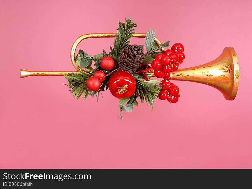 Gold horn Christmas Ornament with holly on Ruby background