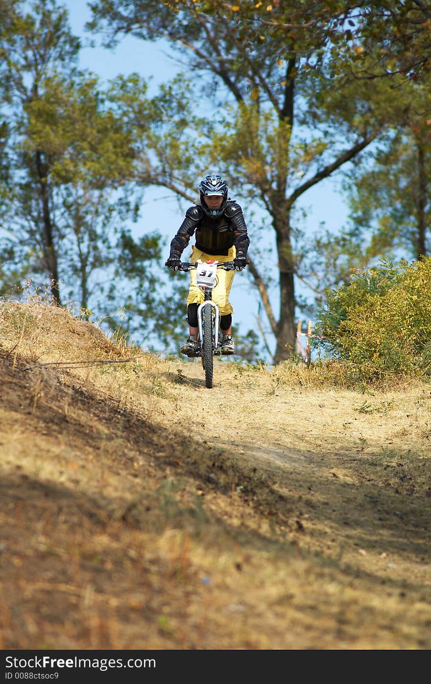 Mountain biker girl on downhill race