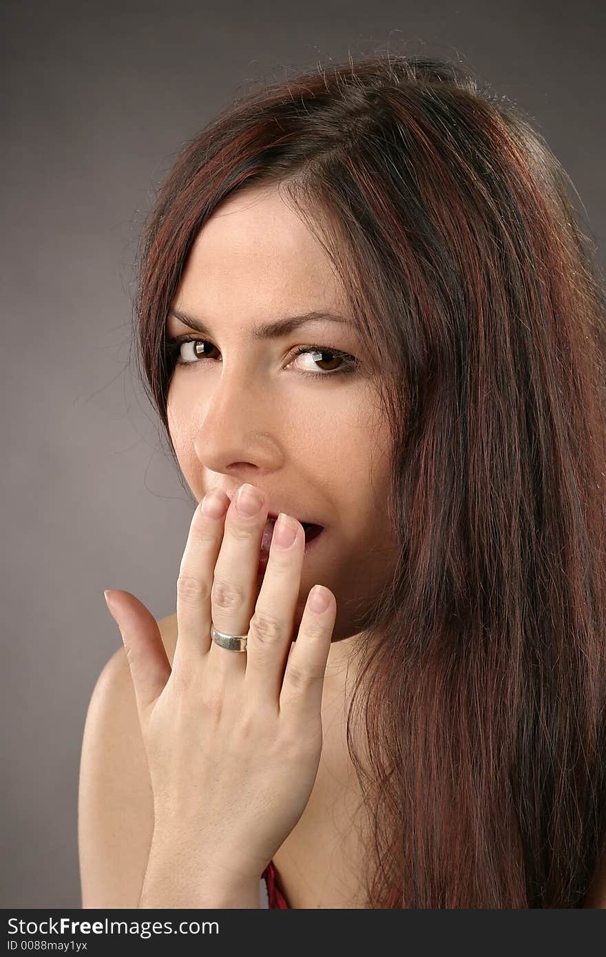 Auburn haired girl, young woman yawning-portrait